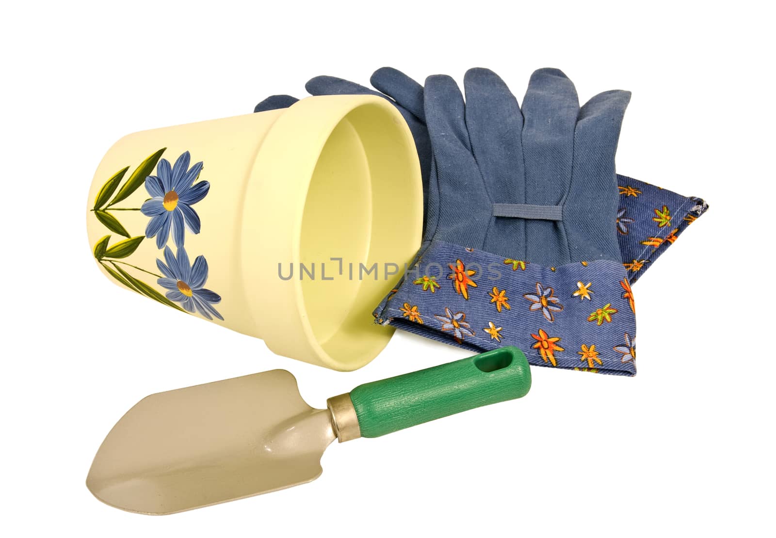 Horizontal shot of yellow flower pot, blue gardening gloves, and little trowel.  Isolated on white