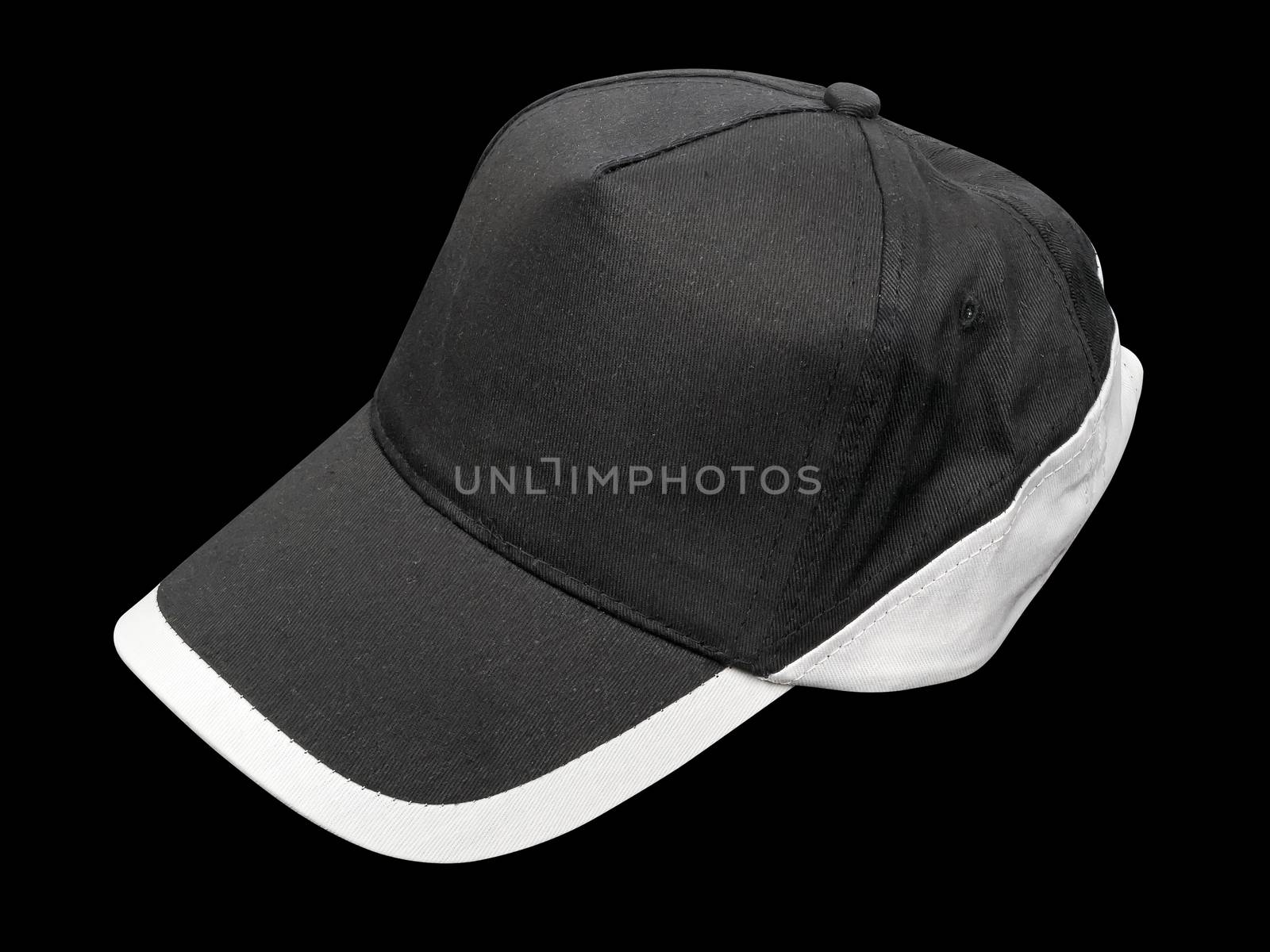 black cap with white border isolated on black background, studio shot