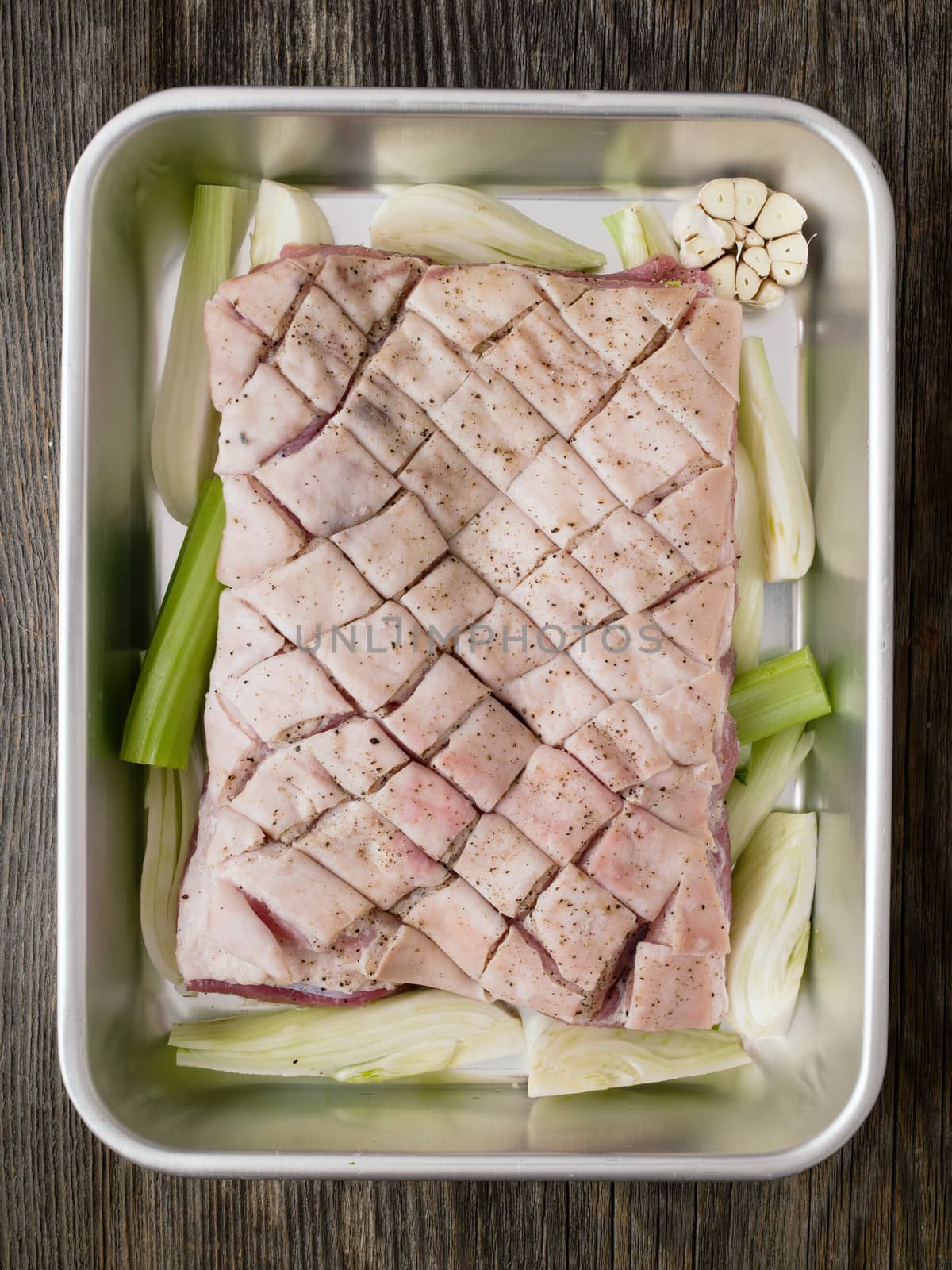 rustic raw uncooked seasoned pork belly by zkruger