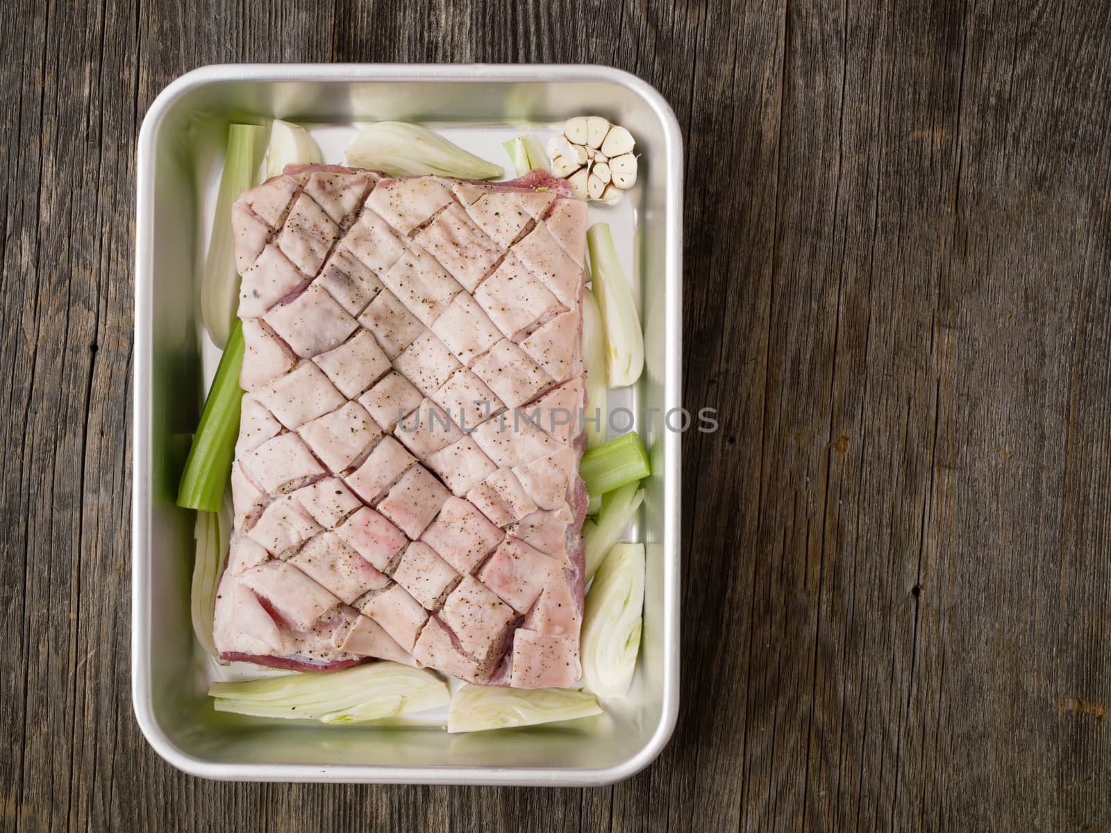 close up of rustic raw uncooked seasoned pork belly