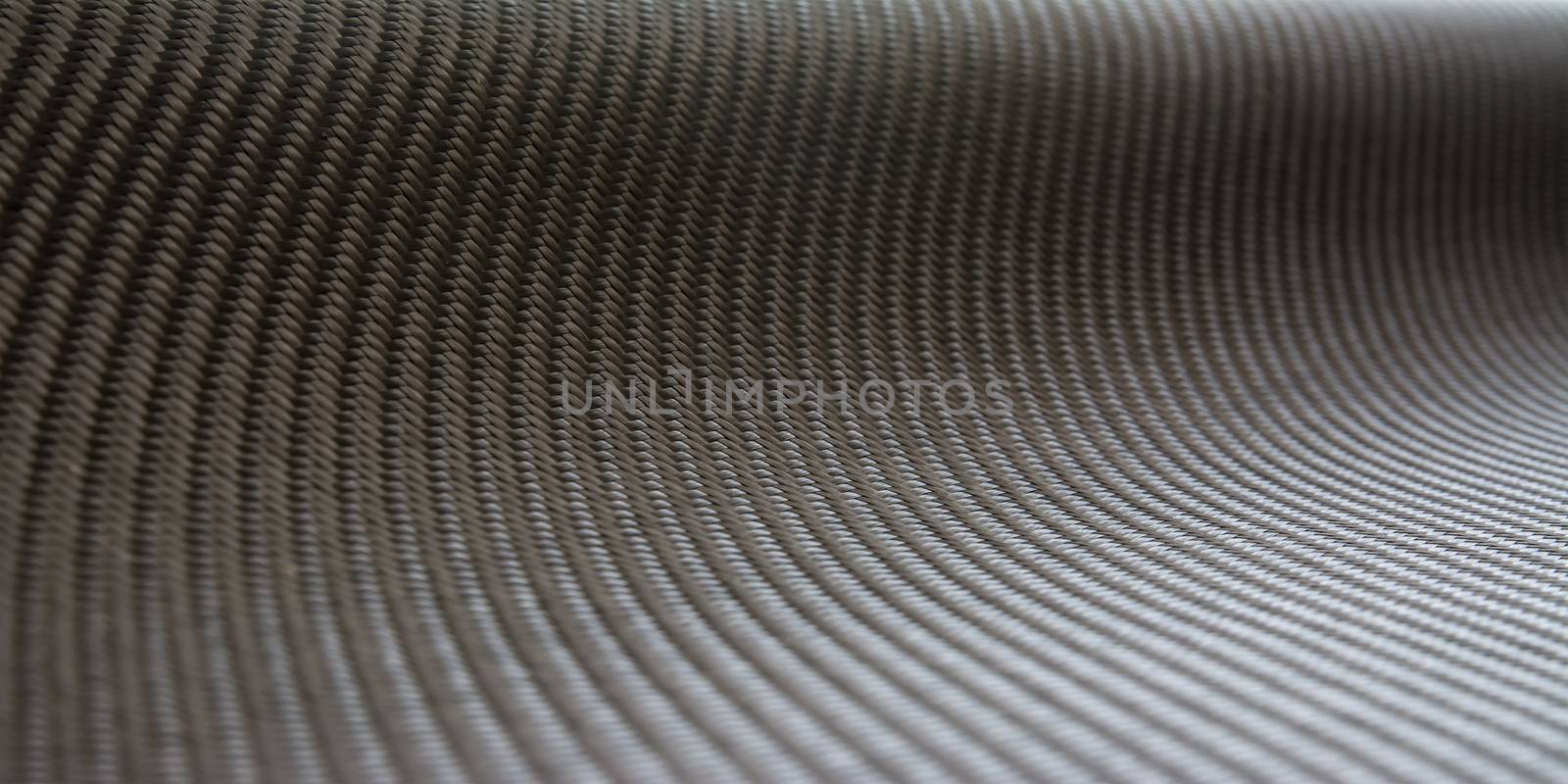 carbon fiber composite material product background by prakasitlalao