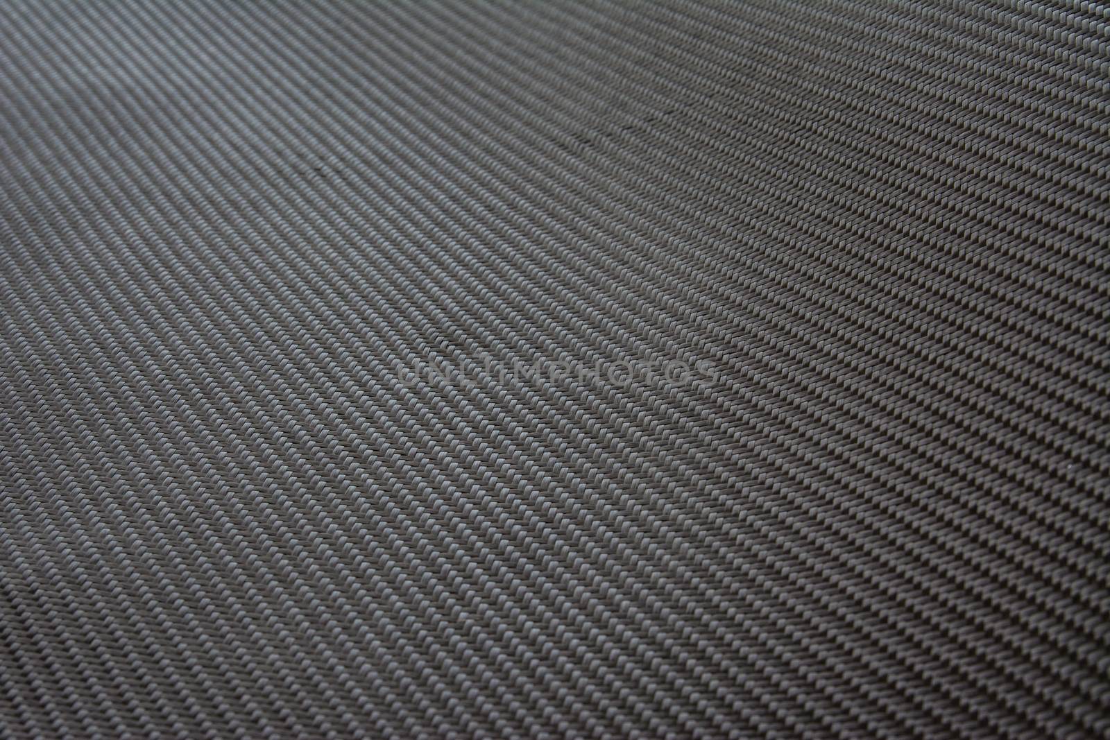 carbon fiber composite material product background by prakasitlalao