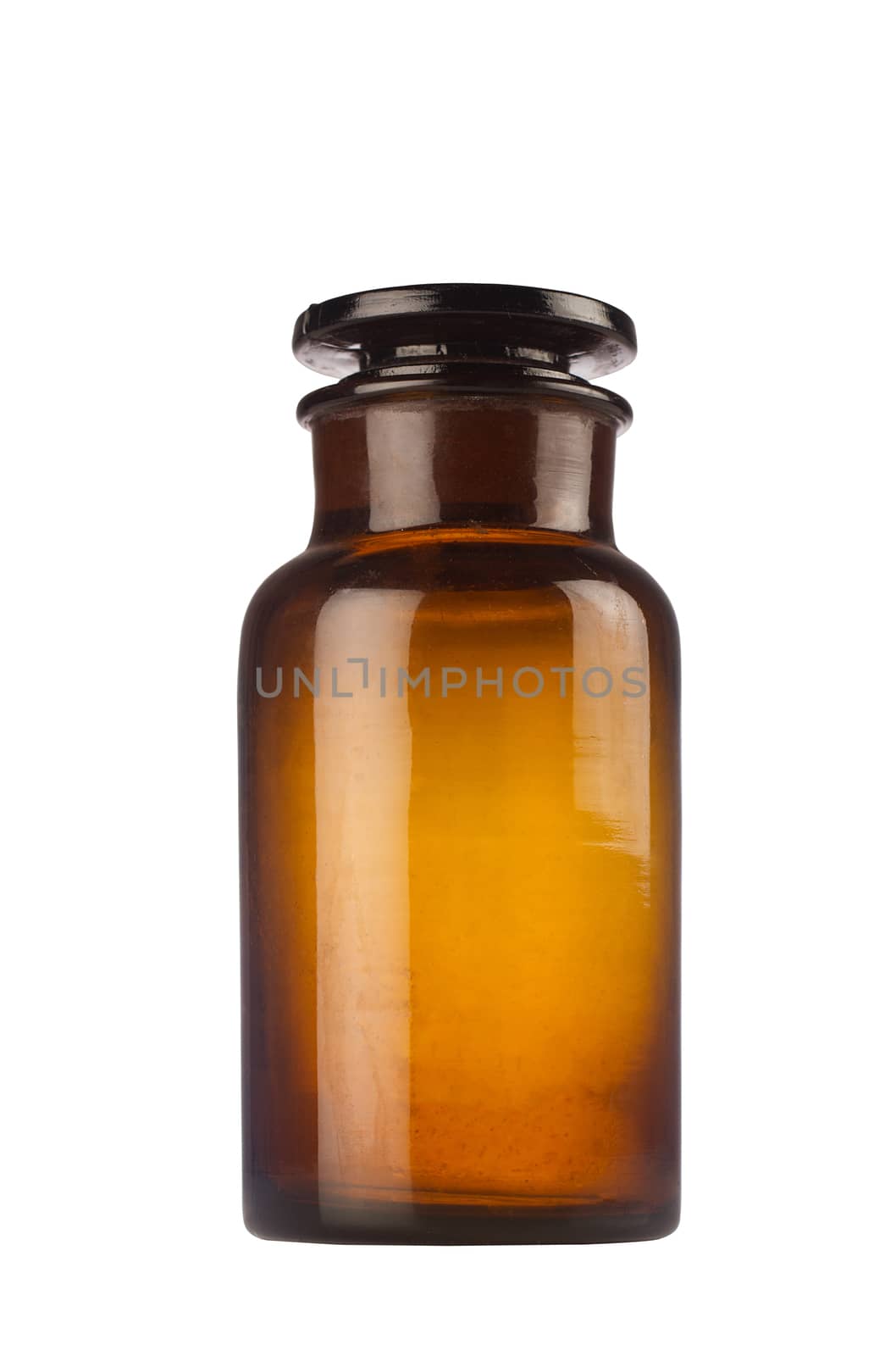One old medical brown glass jar isolated on white background