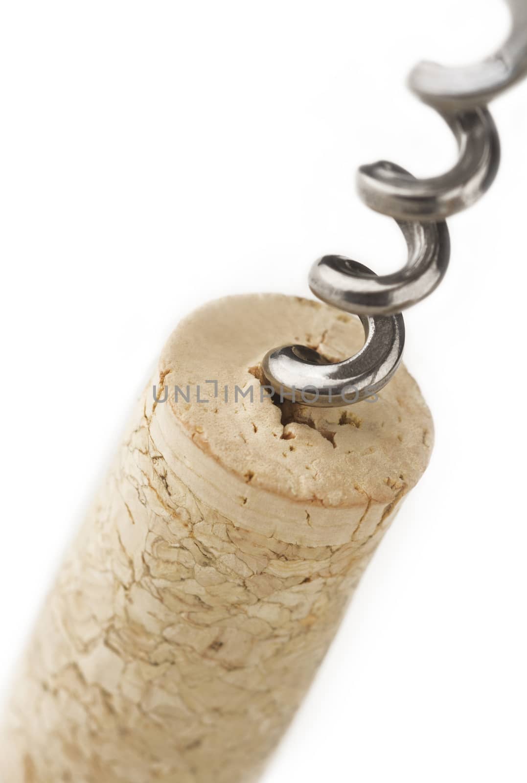 A metal screw in a wine cork isolated on white background