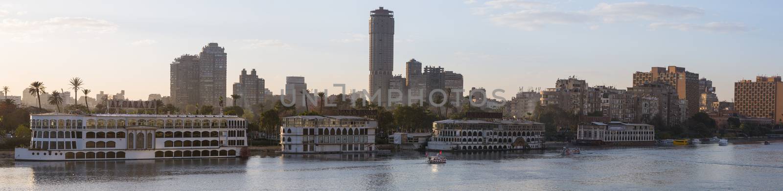 Cairo, Egypt - March 4, 2016: Panoramic view of the Island of Zamalek in central Cairo, with it's famous boat restaurants on the Nile river.