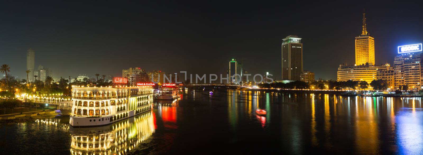 Cairo, Egypt - March 4, 2016: Central Cairo at night, the Nile river, the Corniche Street and the Island of Zamalek with it's famous boat restaurants.