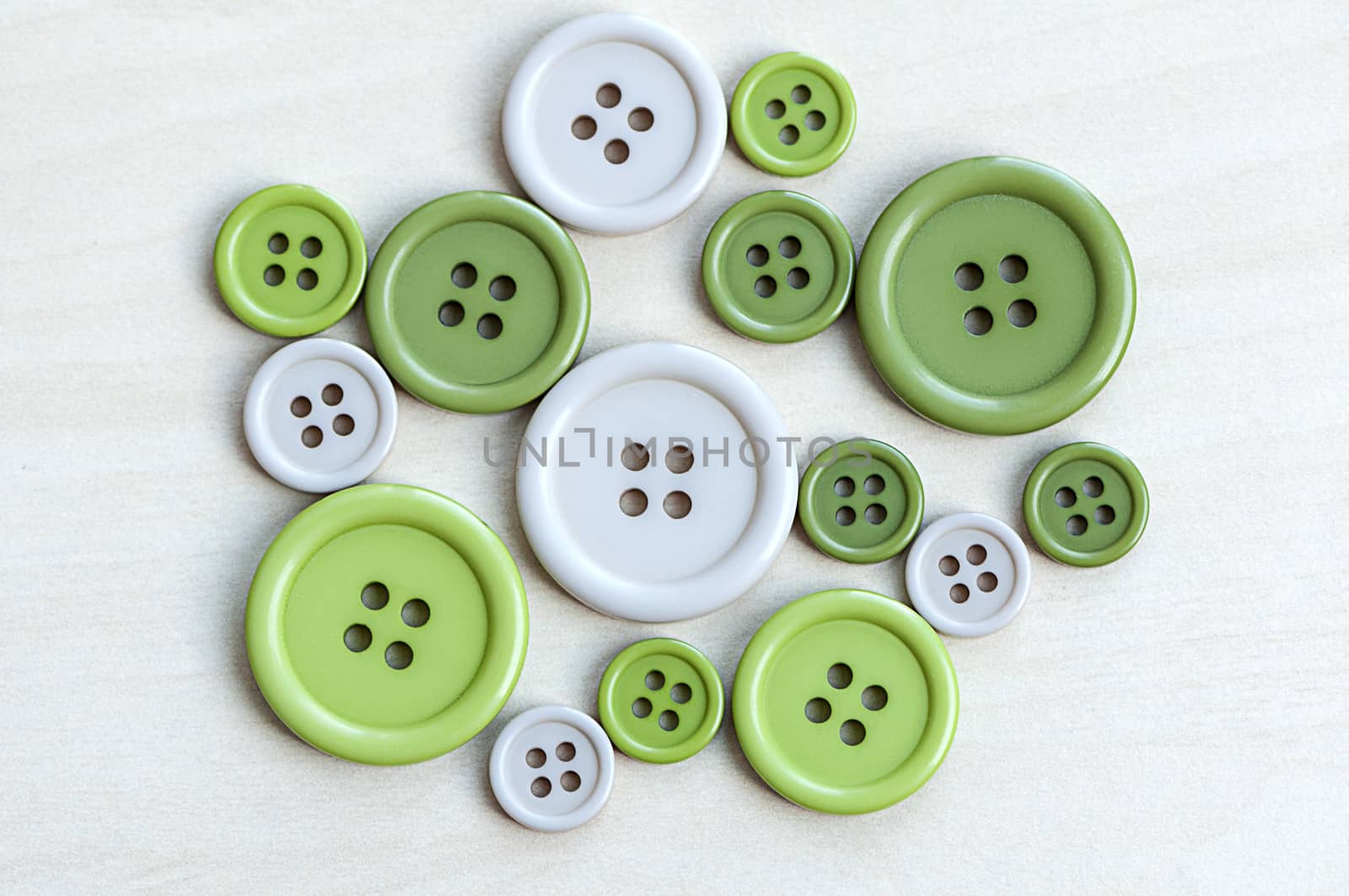 Colored plastic buttons on a wood table