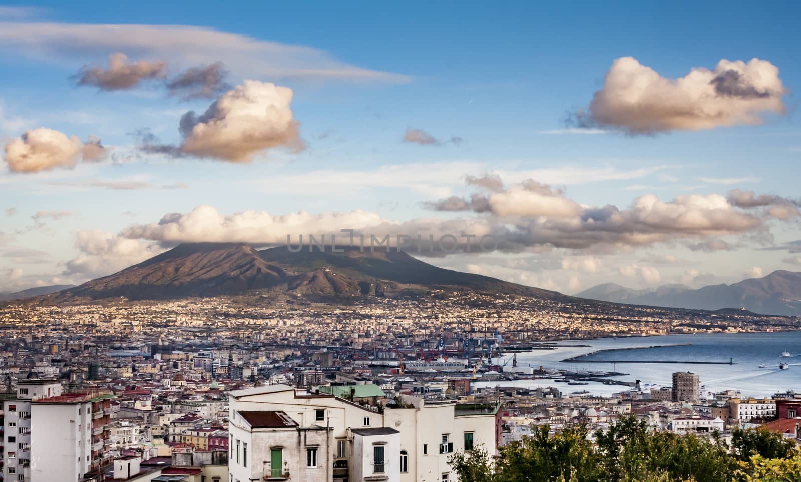 NAPLES - DECEMBER 4: Naples and mount Vesuvius in the background at sunset in a winter day on December 4, 2011 in Naples, Italy