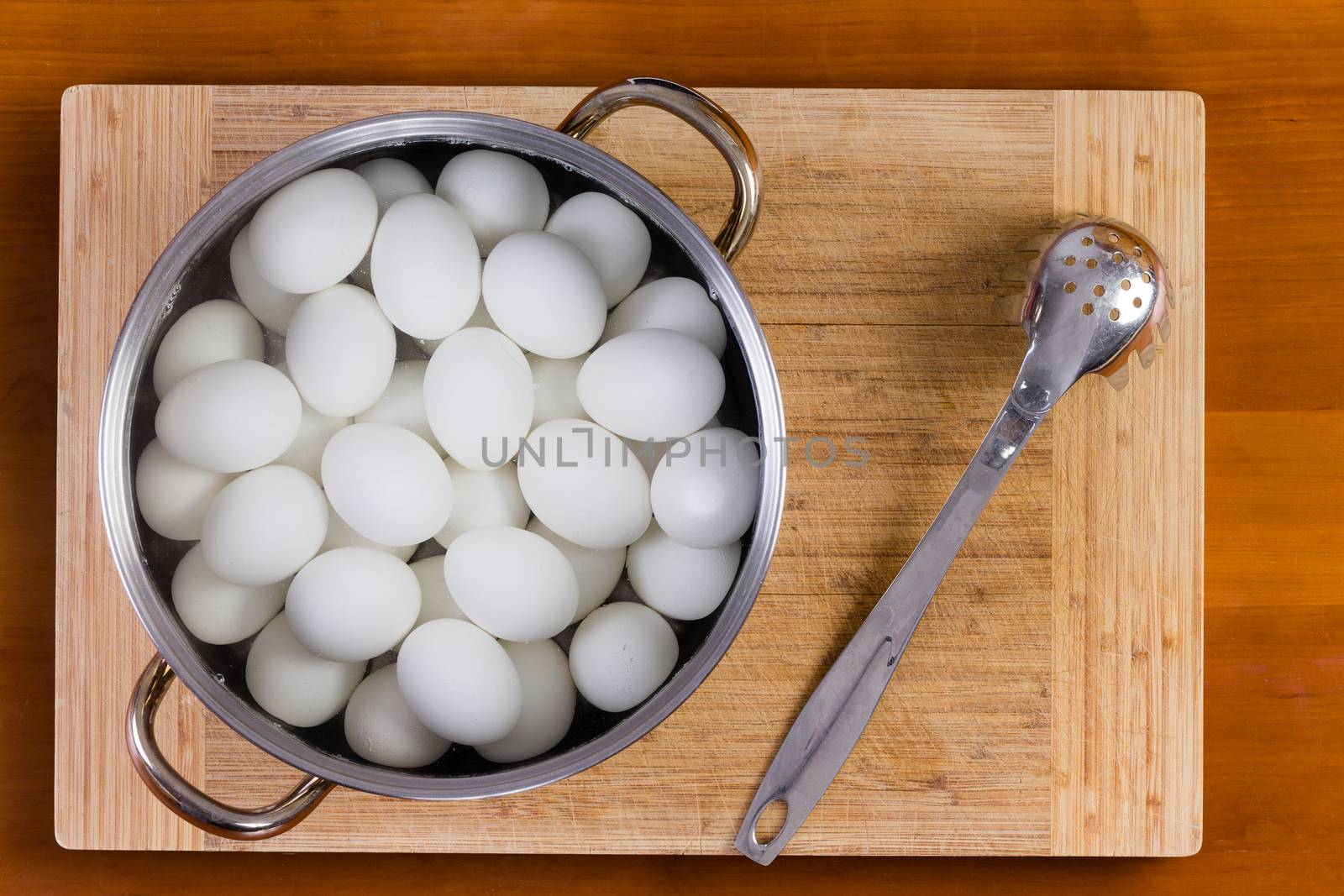 Boiled white hens eggs cooling for decorating by coskun