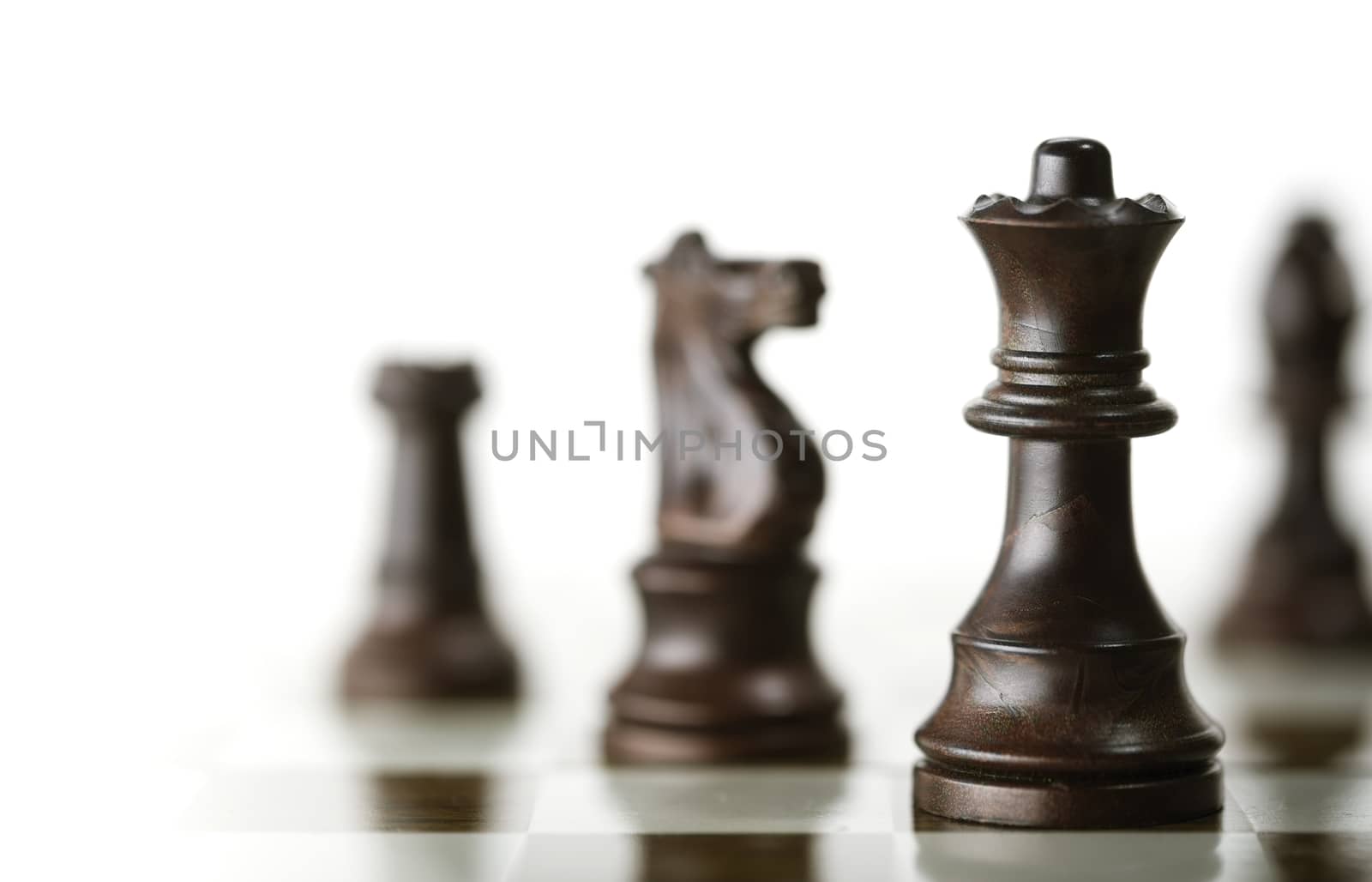 Chess Game over White Background by Olivier-Le-Moal