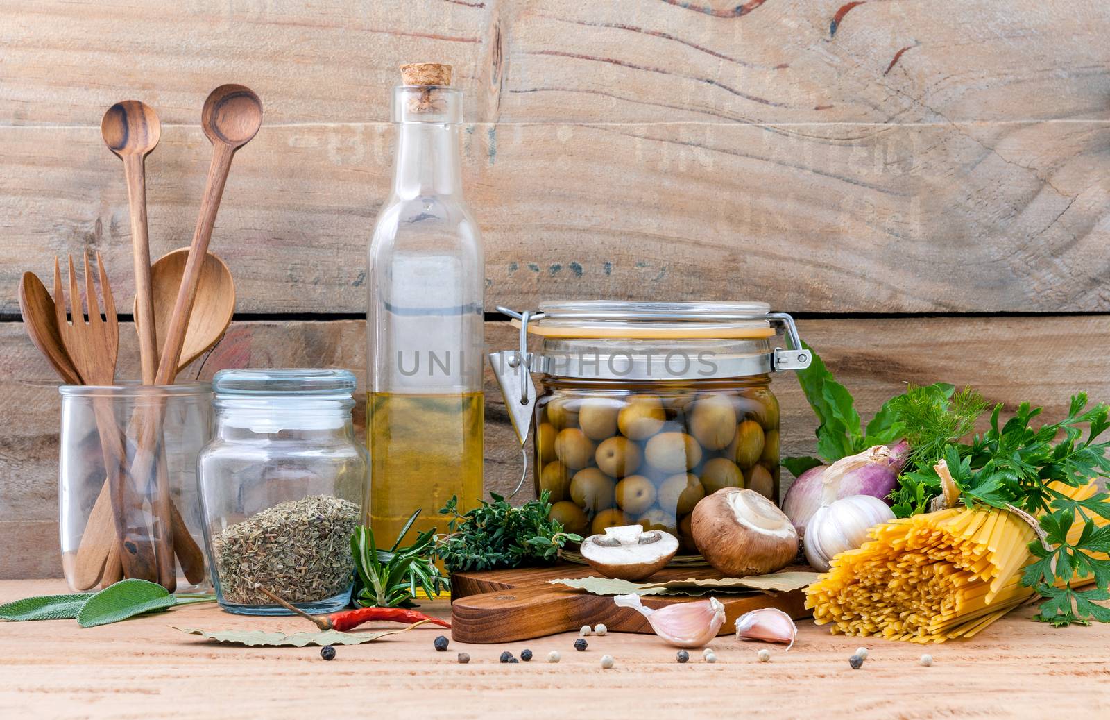 Italian food concept pasta with vegetables olive oil flavored and sesame oil with spices herb rosemary ,thyme,dill,sage,parsley and champignon mushroom set up with old wooden background.