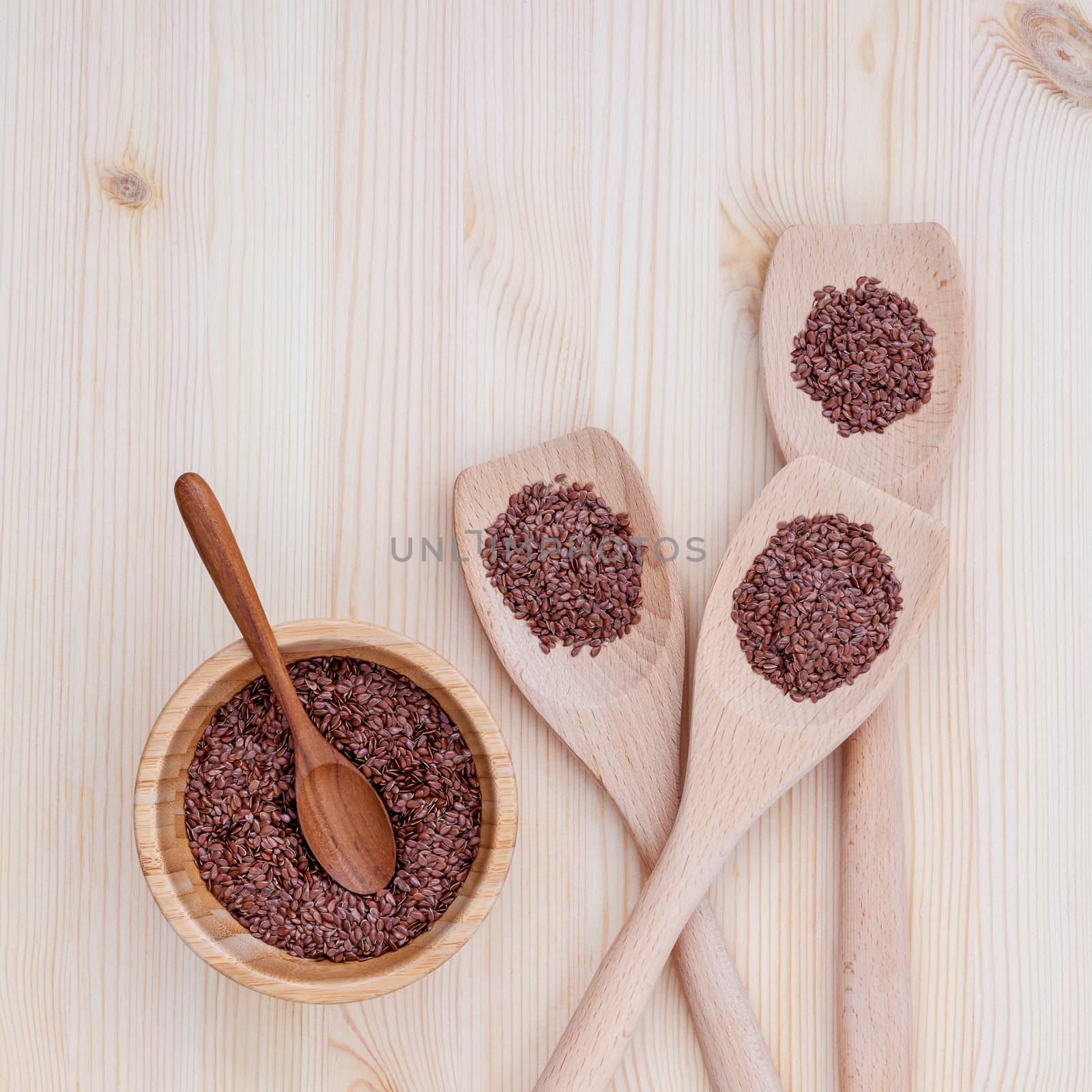 Alternative health care and dieting flax seeds in wooden spoon s by kerdkanno