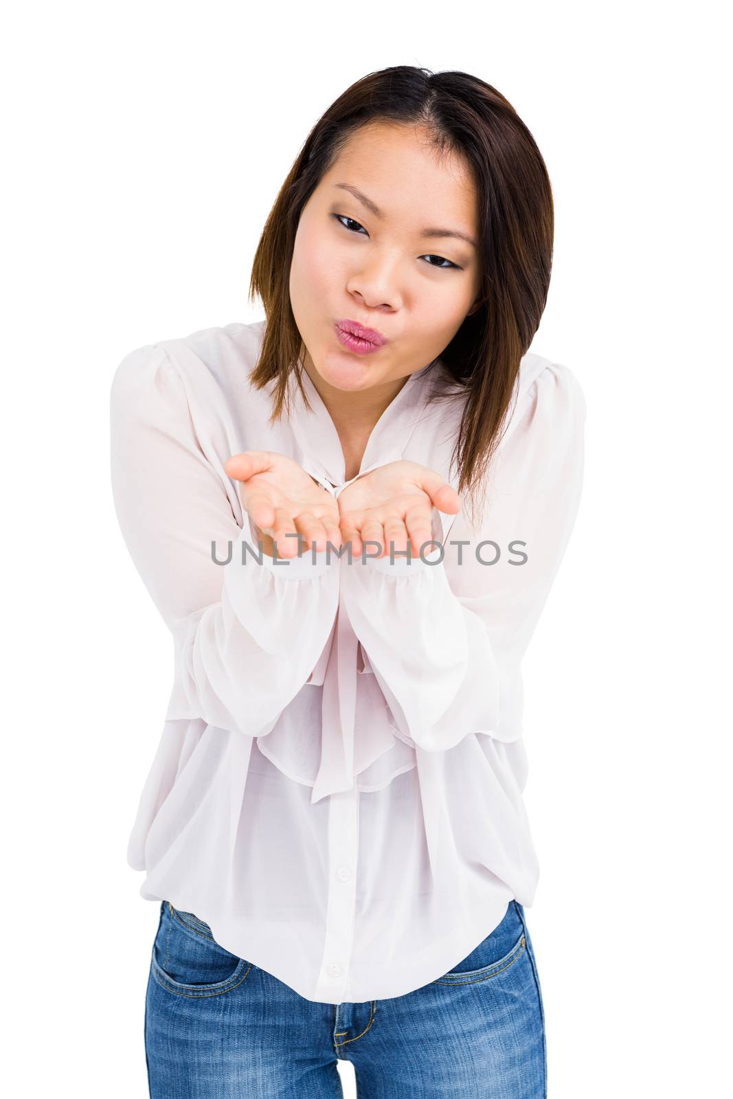 Young woman blowing a kiss by Wavebreakmedia