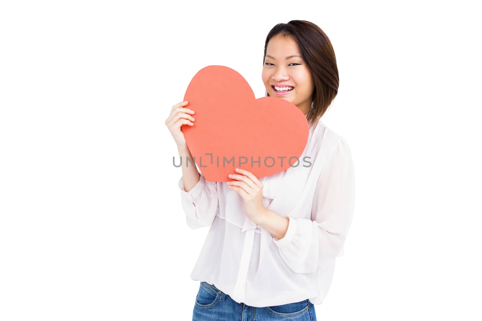 Woman holding heart shape by Wavebreakmedia