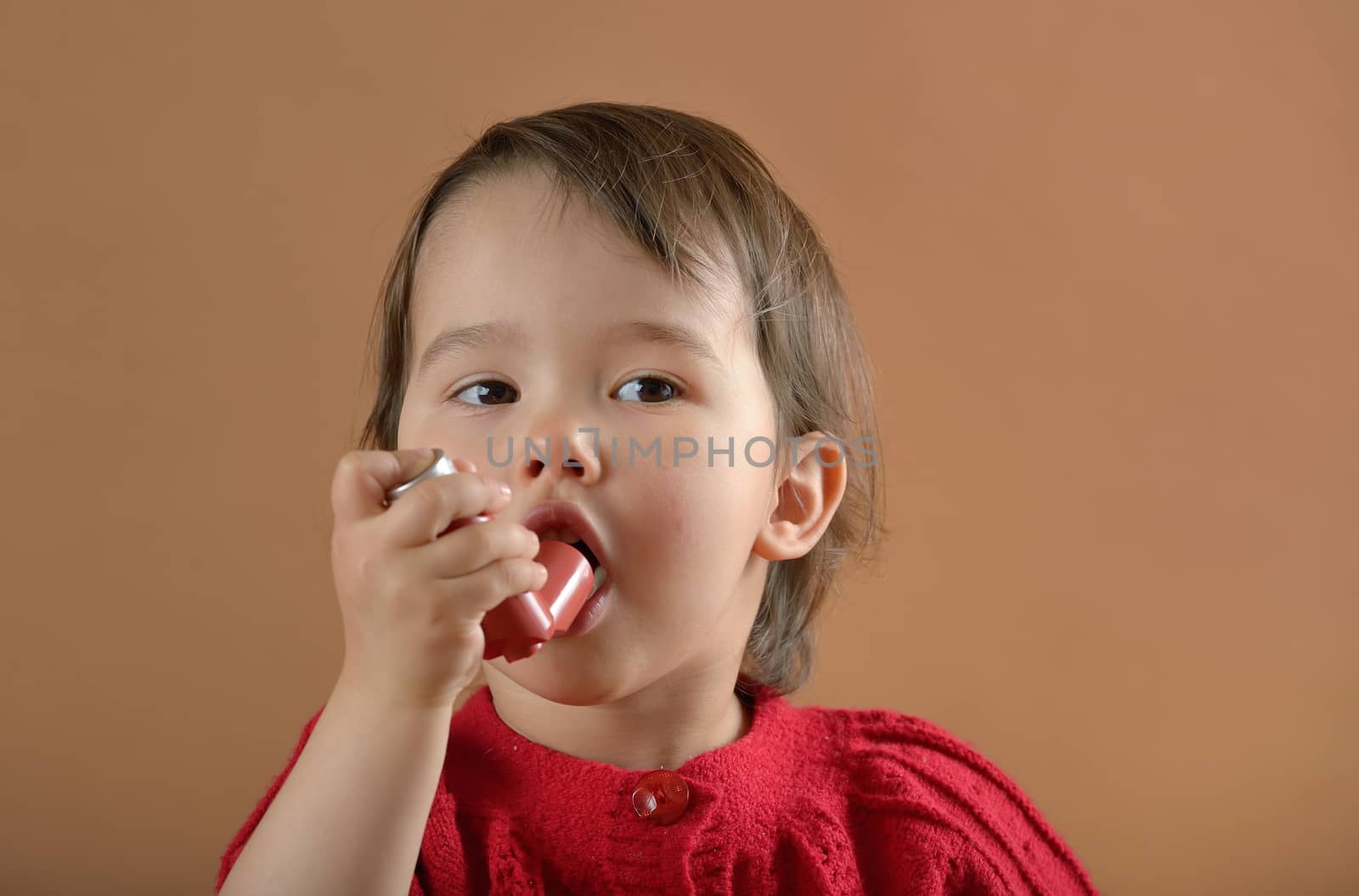 Little girl breathing asthmatic medicine health-care inhaler