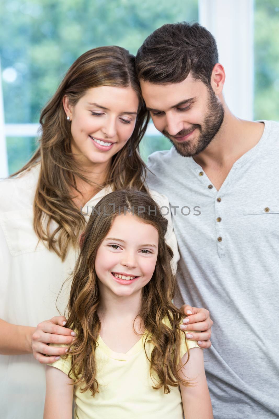 Close-up of happy family standing at home 