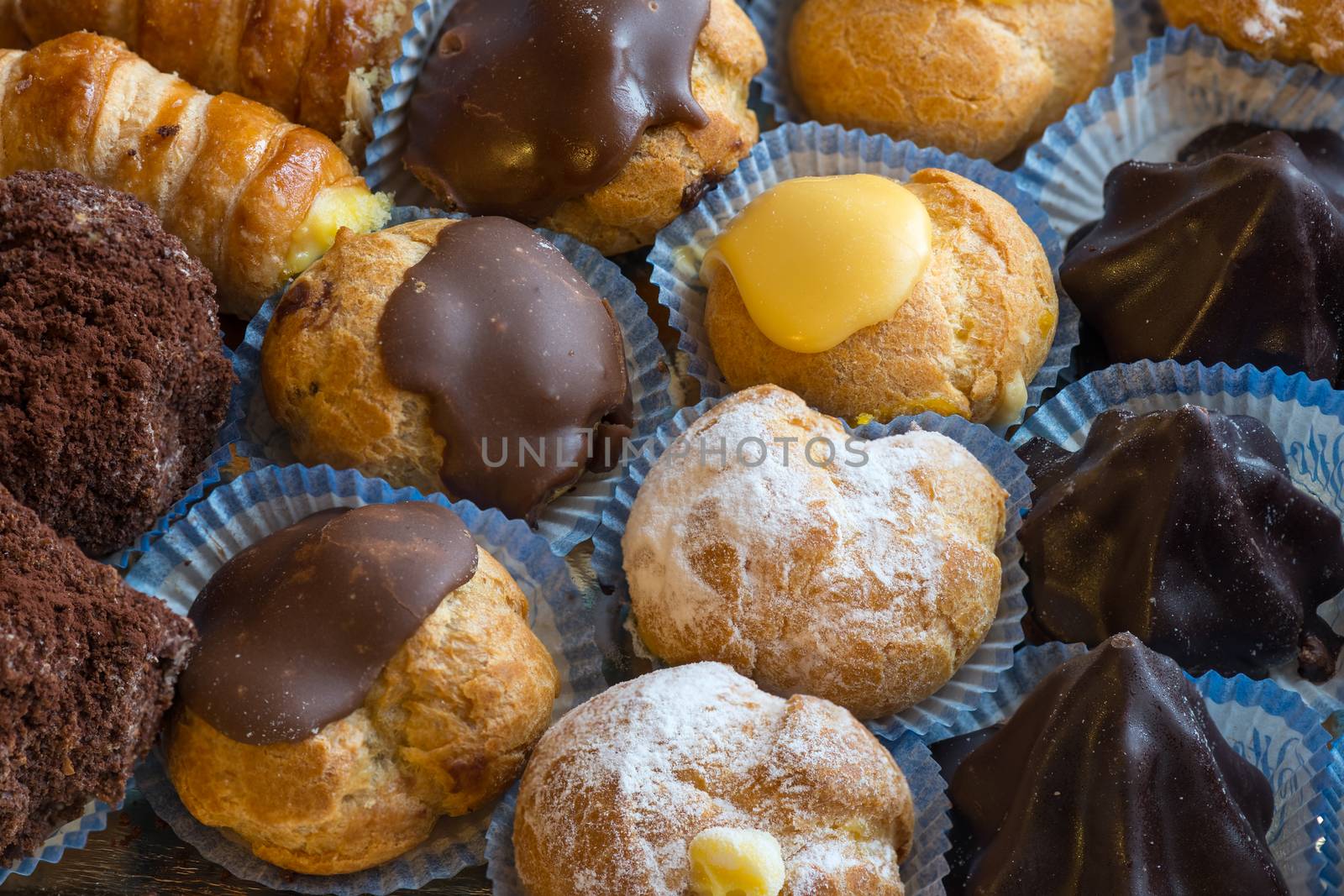 In the pictured colorful pastries with candied,cream and chocolate from above,the real Italian confectionery.