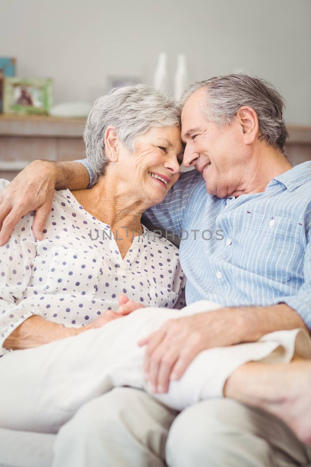 High angle view of romantic senior couple sitting at home