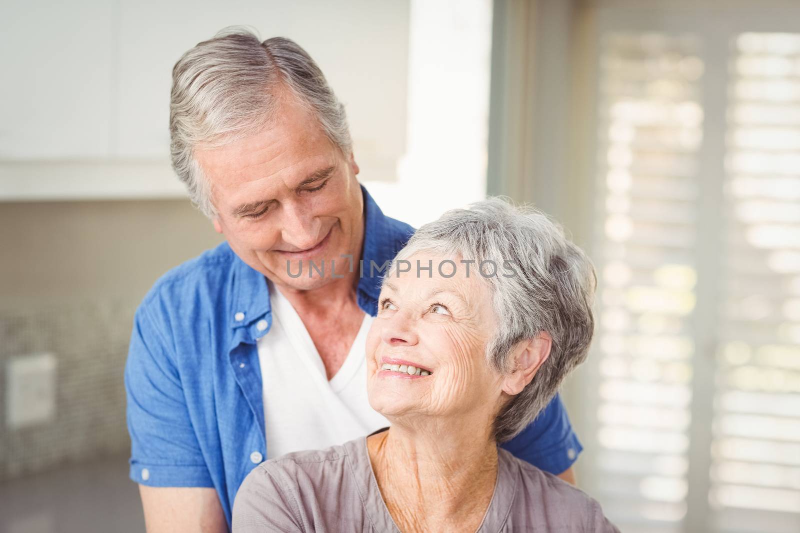 Happy romantic senior couple looking at each other by Wavebreakmedia