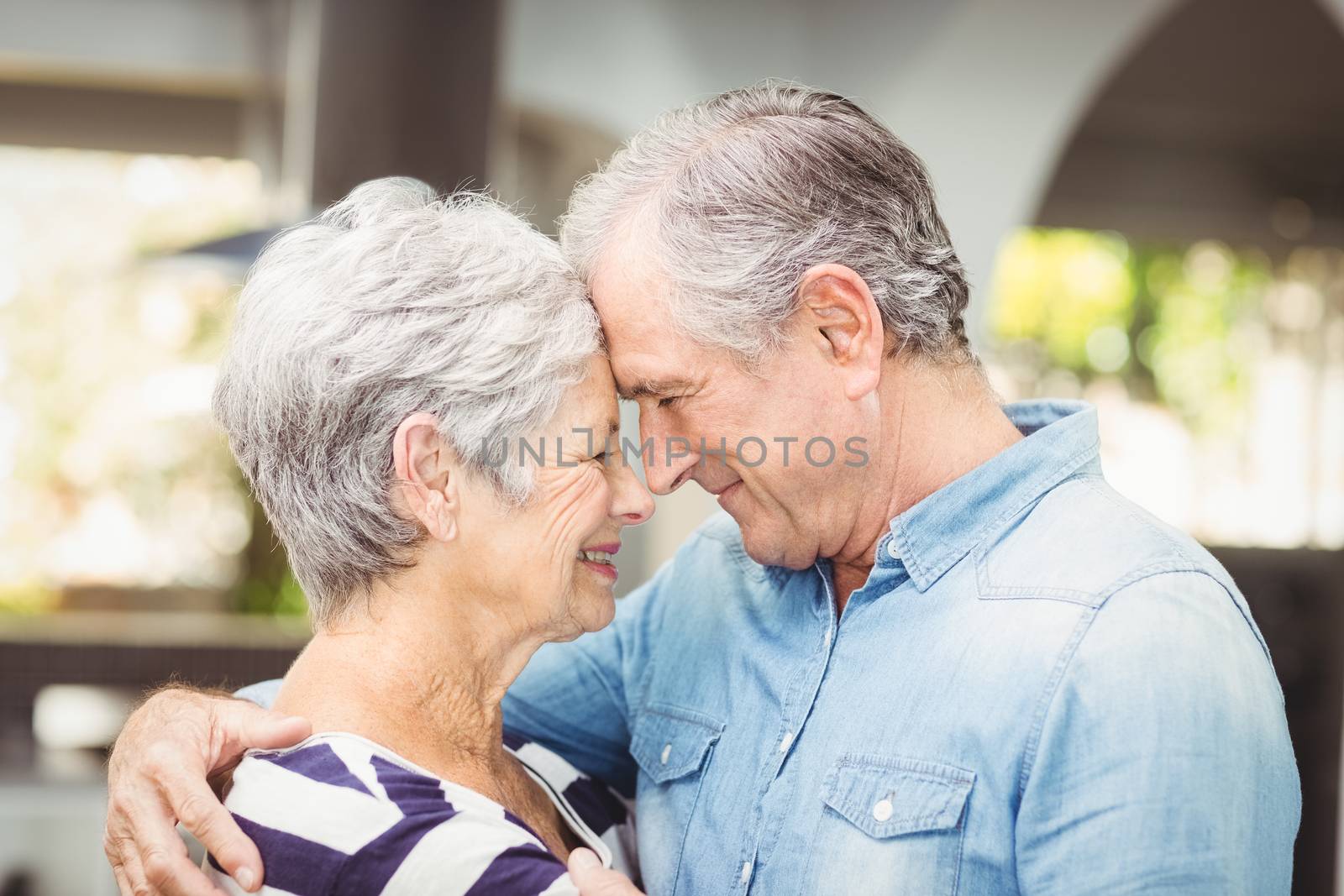 Close-up of romantic senior husband embracing wife by Wavebreakmedia