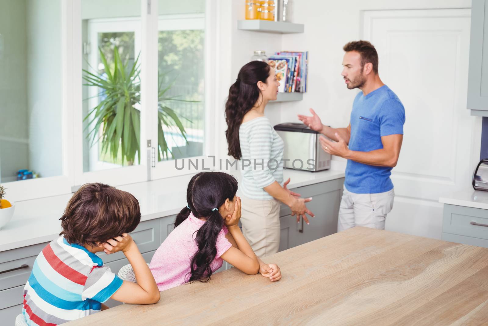  Children looking at parents  by Wavebreakmedia