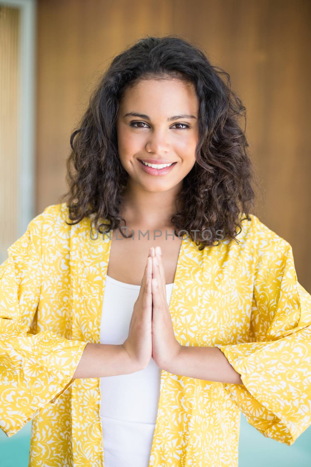 Young woman practicing yoga by Wavebreakmedia