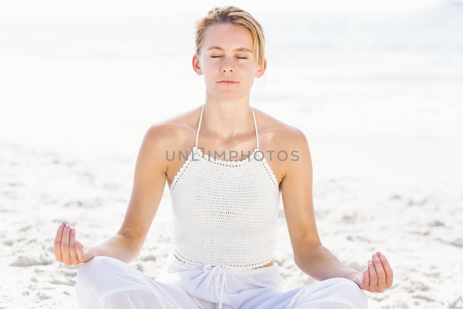 Beautiful woman in lotus position by Wavebreakmedia