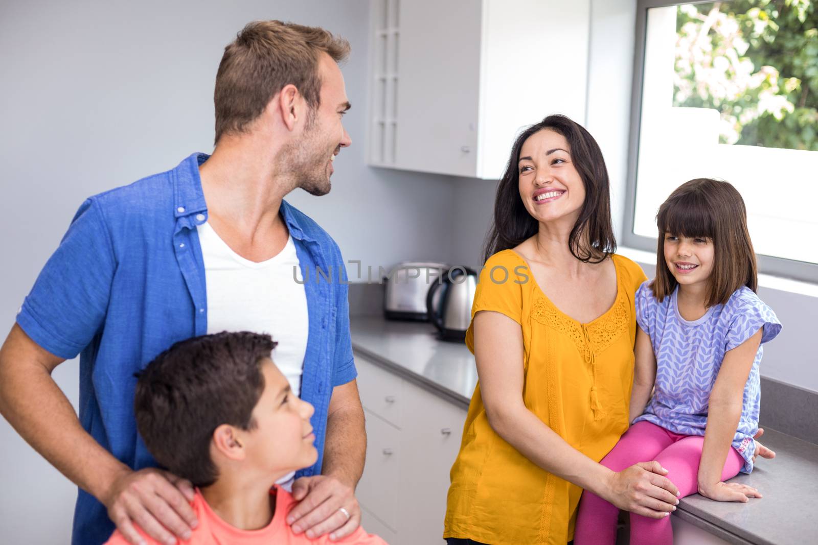 Happy family in the kitchen at home