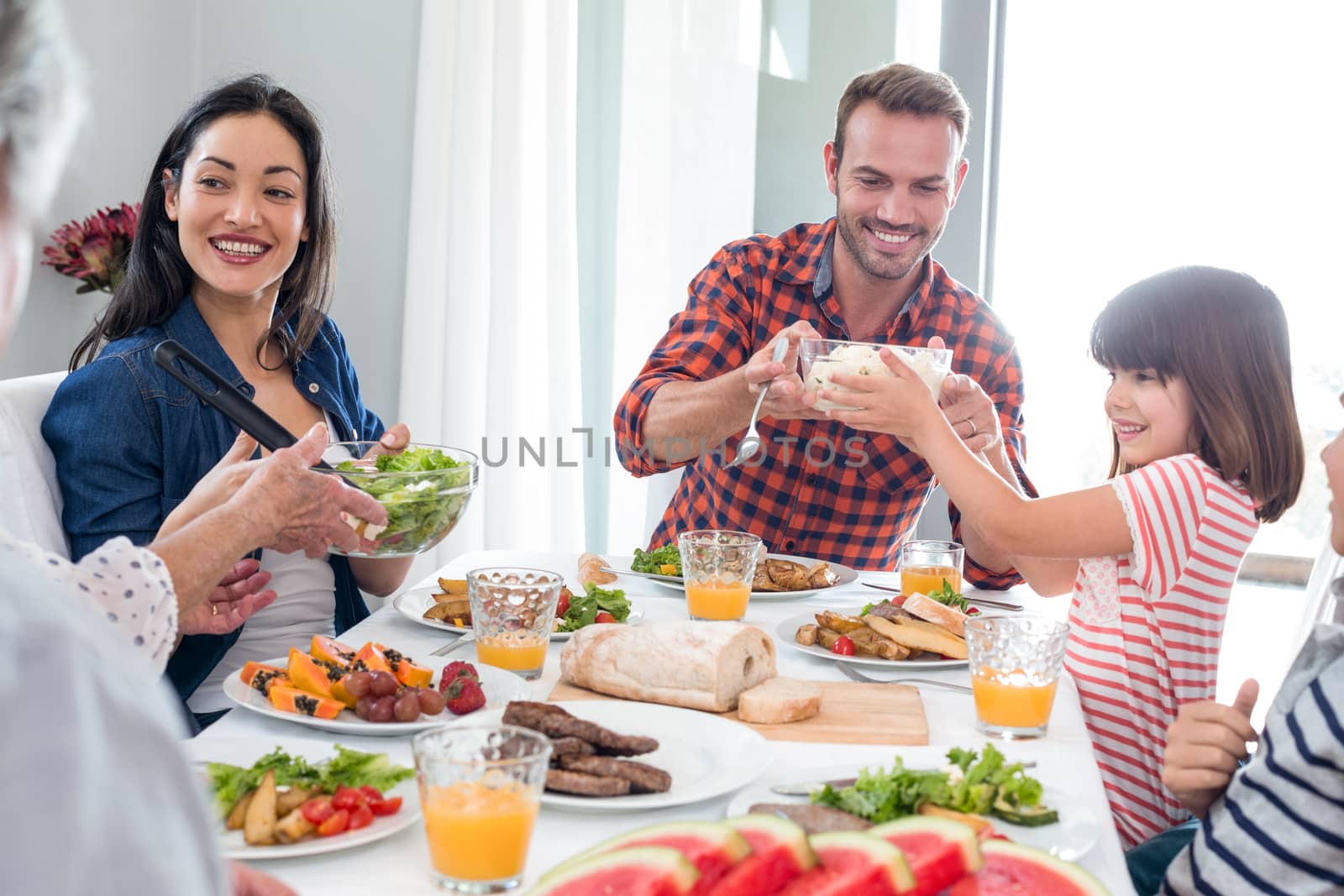 Happy family having breakfast in the morning