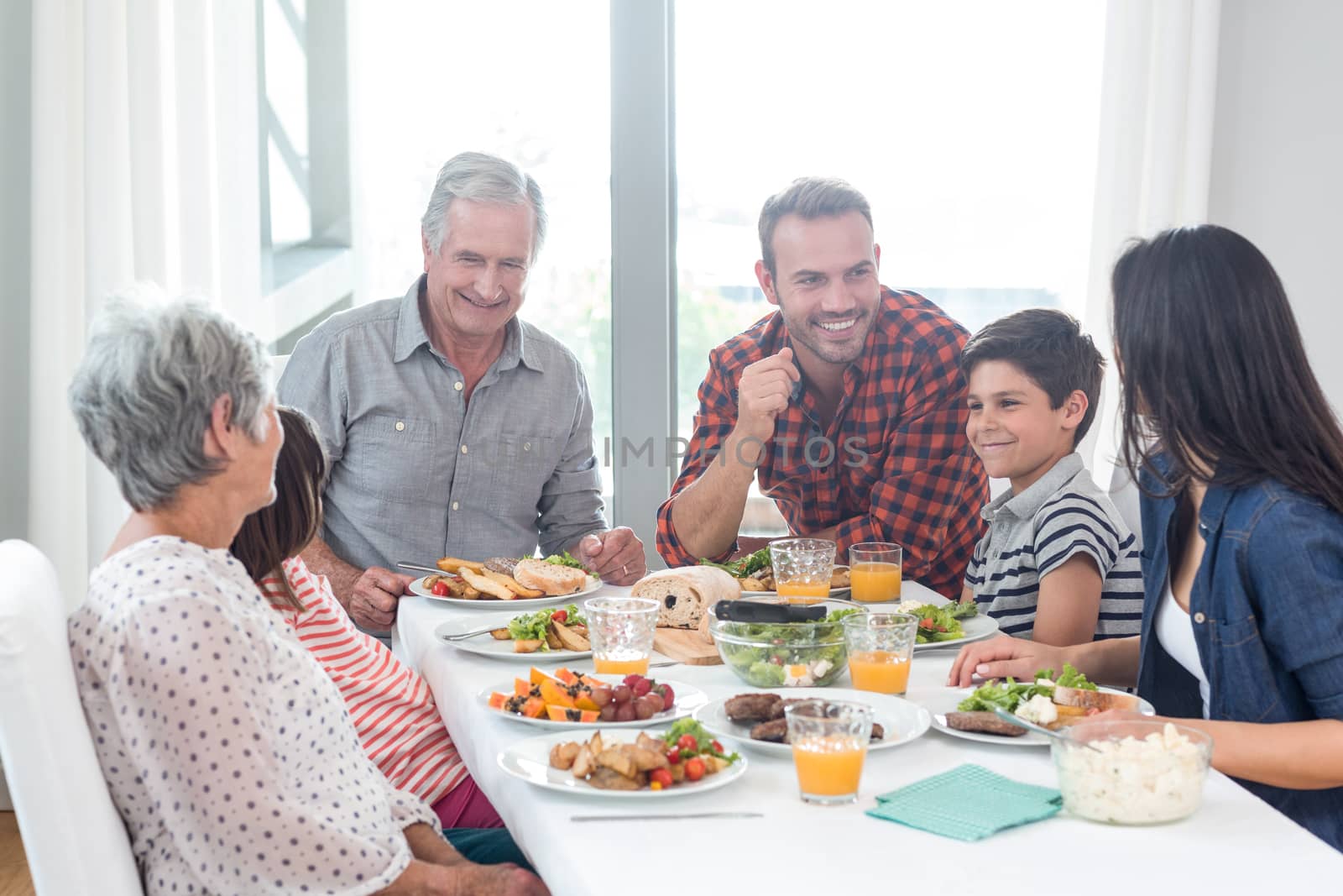 Happy family having breakfast in the morning