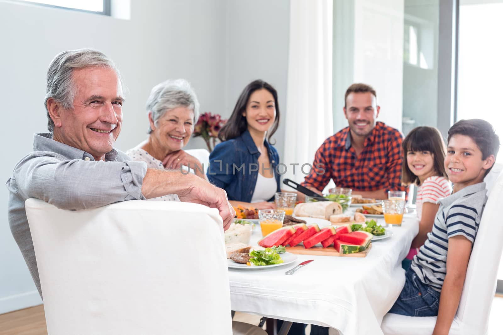 Happy family having breakfast by Wavebreakmedia