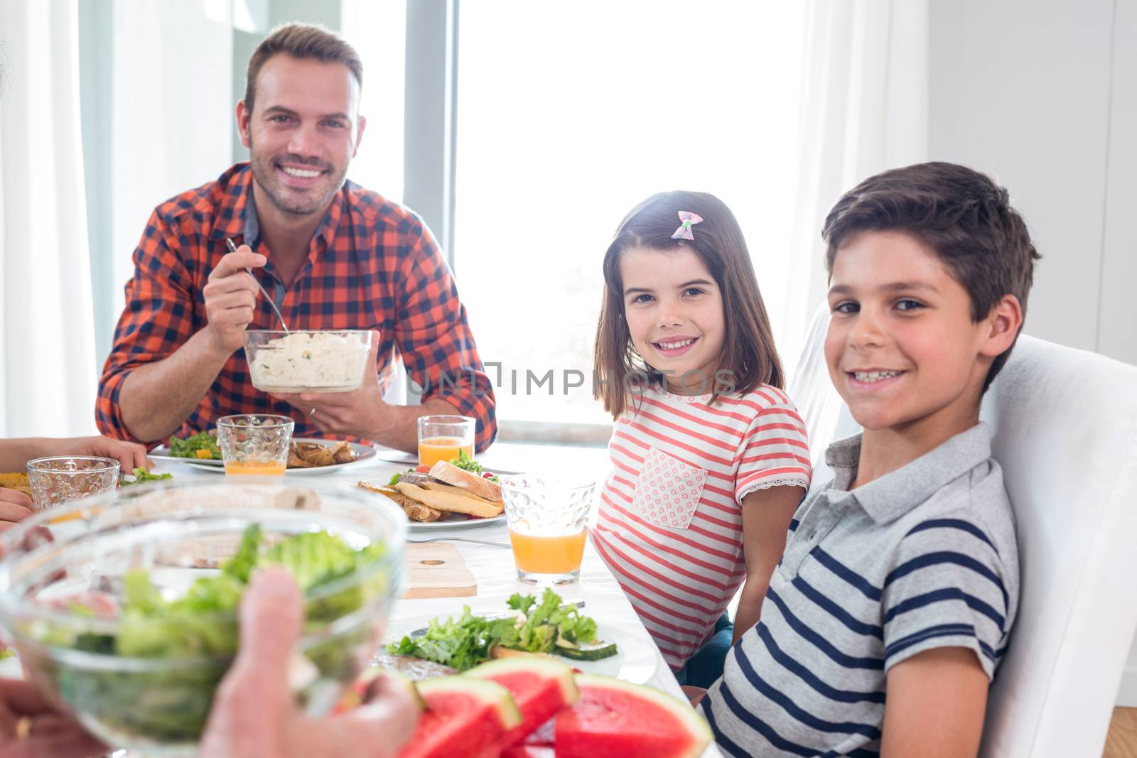 Happy family having breakfast in the morning