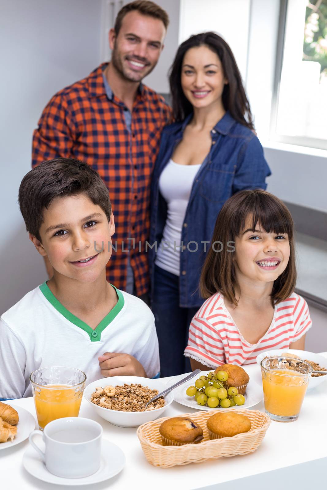 Happy family in kitchen by Wavebreakmedia