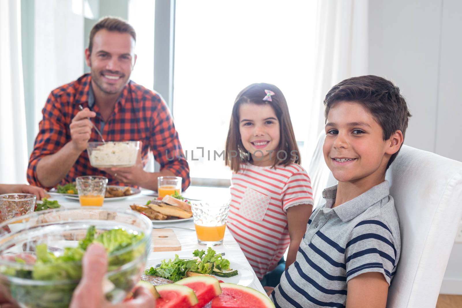 Happy family having breakfast in the morning