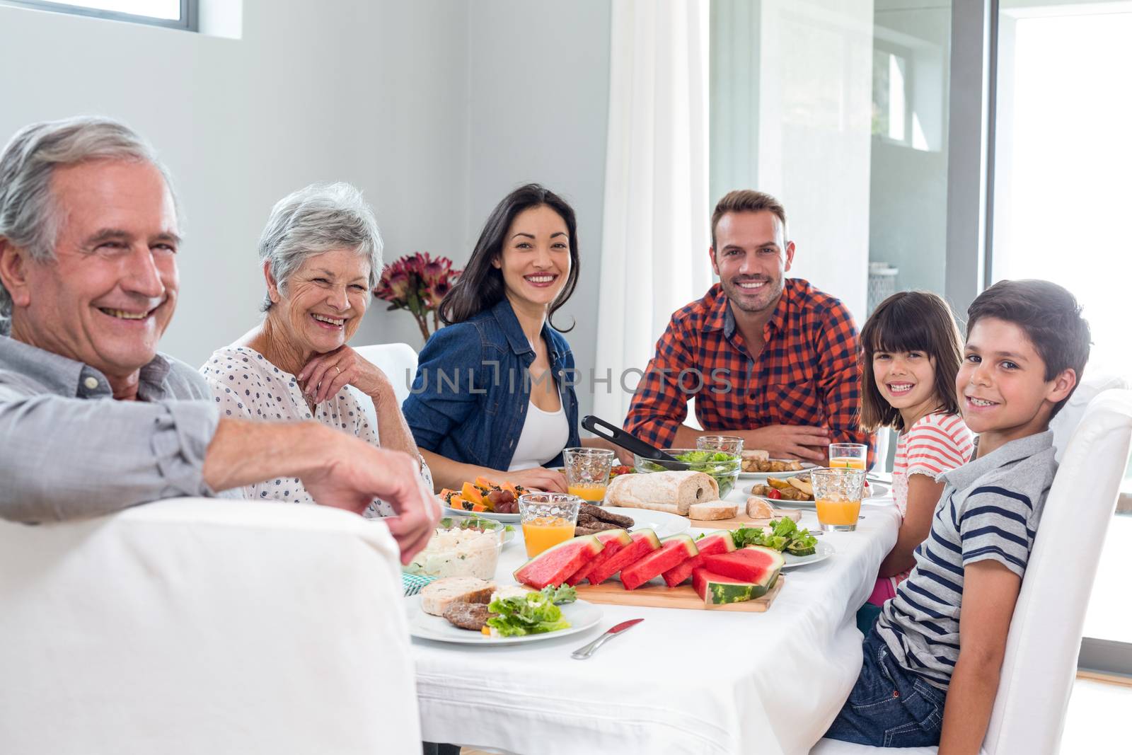 Happy family having breakfast by Wavebreakmedia