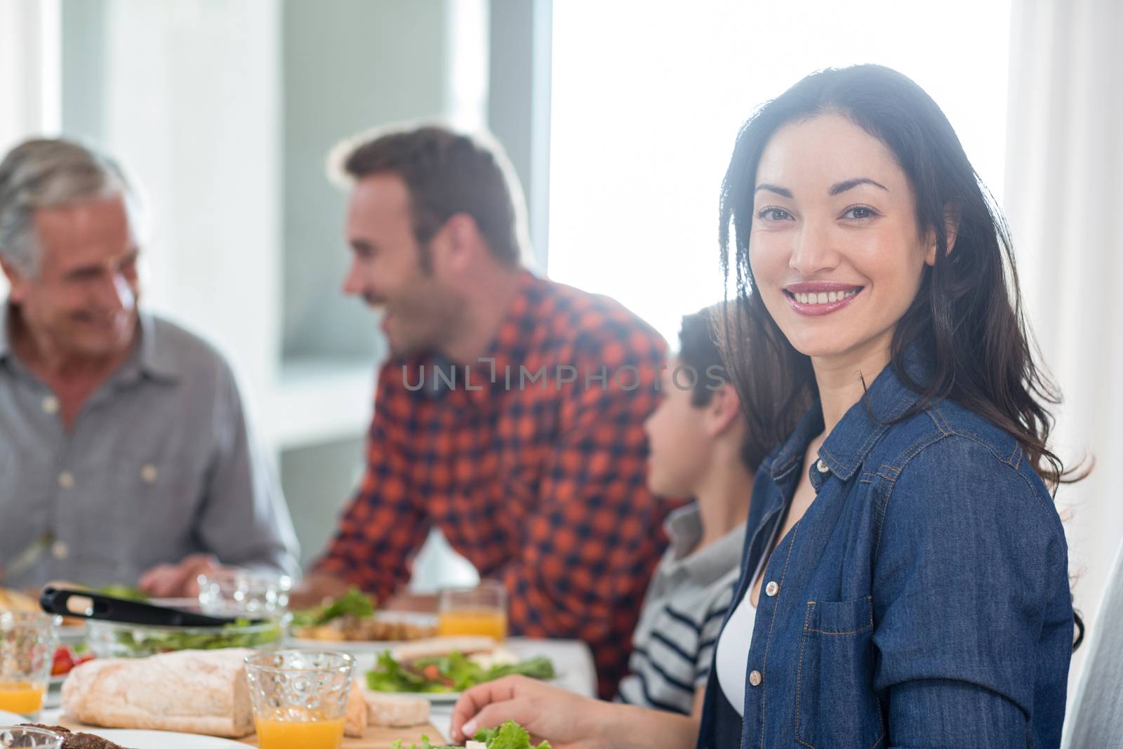 Happy family having breakfast by Wavebreakmedia