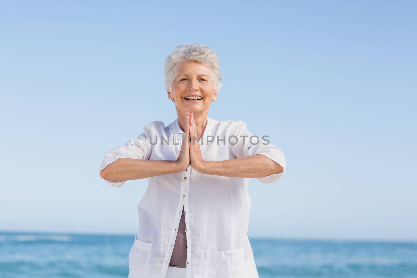 Senior woman doing yoga by Wavebreakmedia
