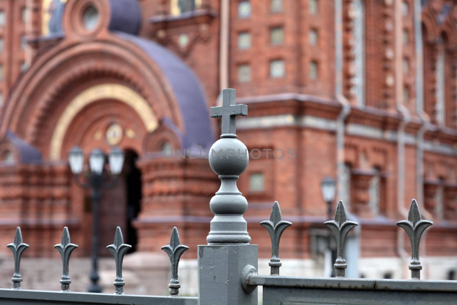 metallic fence decoration with cross  on background of the church