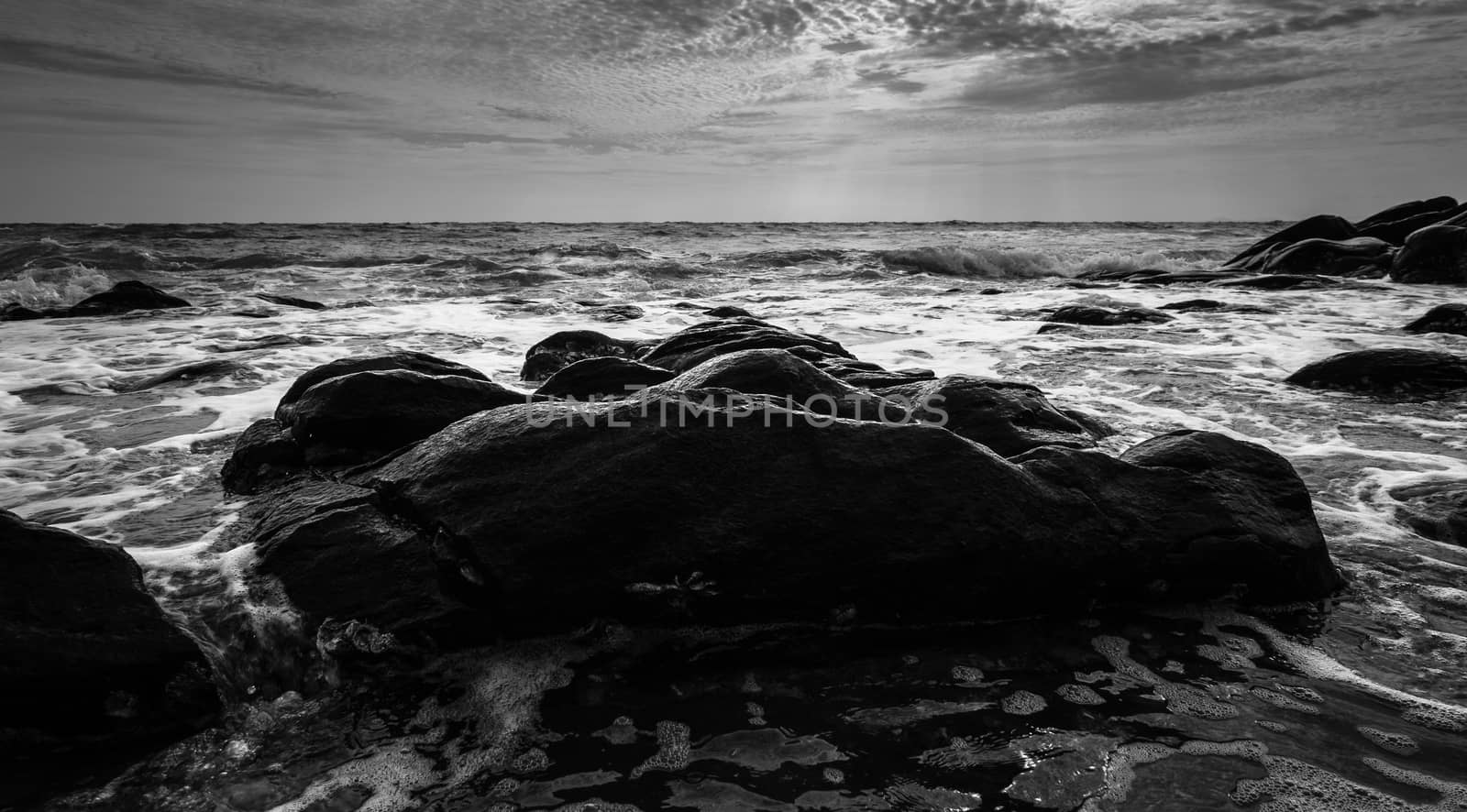 Black and white Beach rock and blue sea in Thailand