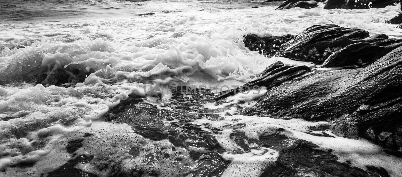 Black and white Beach rock and blue sea in Thailand