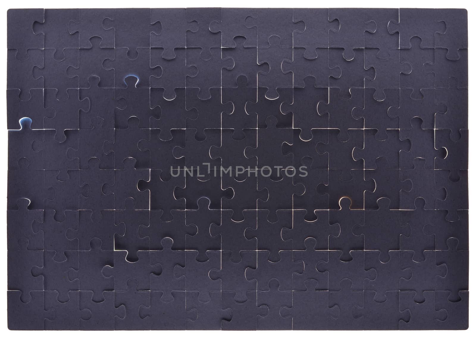 Grey puzzle pieces background, close up view