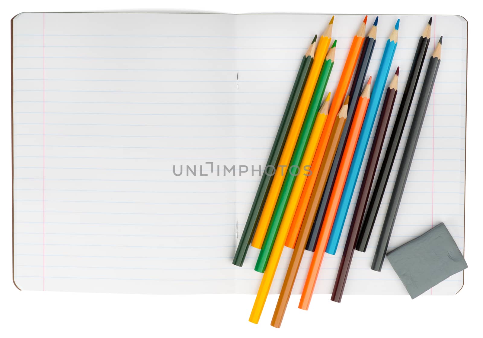 Open notebook with crayons and eraser on isolated white background, closeup