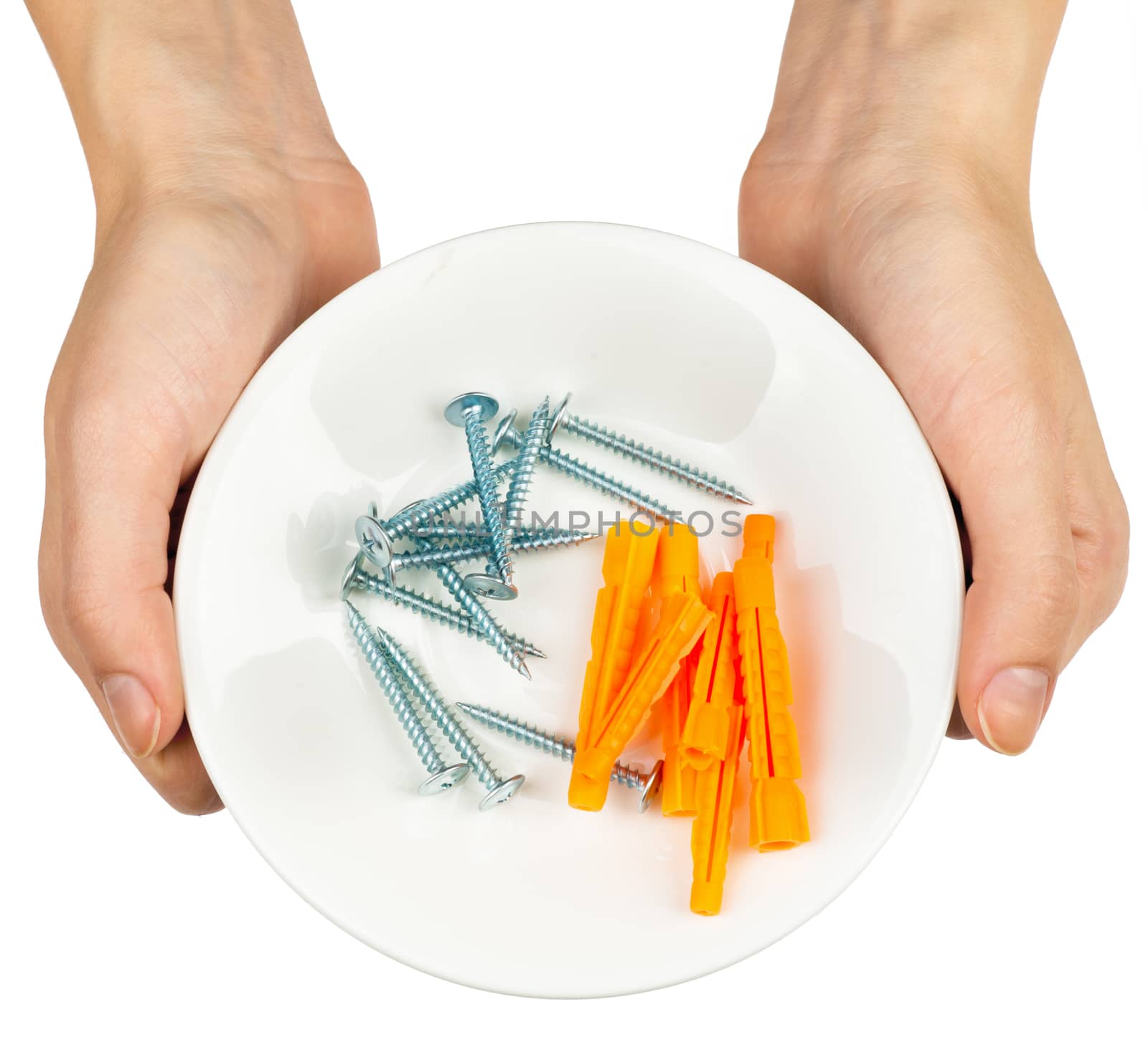 Female hands holding plate with screws on isolated white background