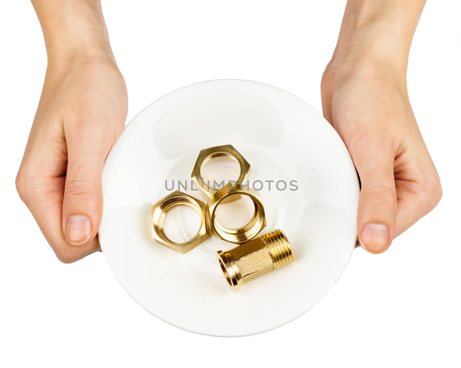 Female hands holding plate with screwnuts on isolated white background