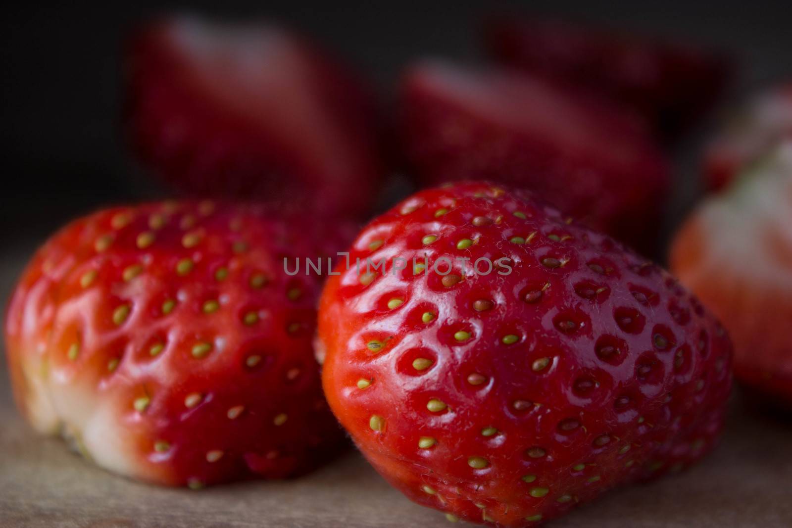 red ripe  fresh strawberries on wooden table