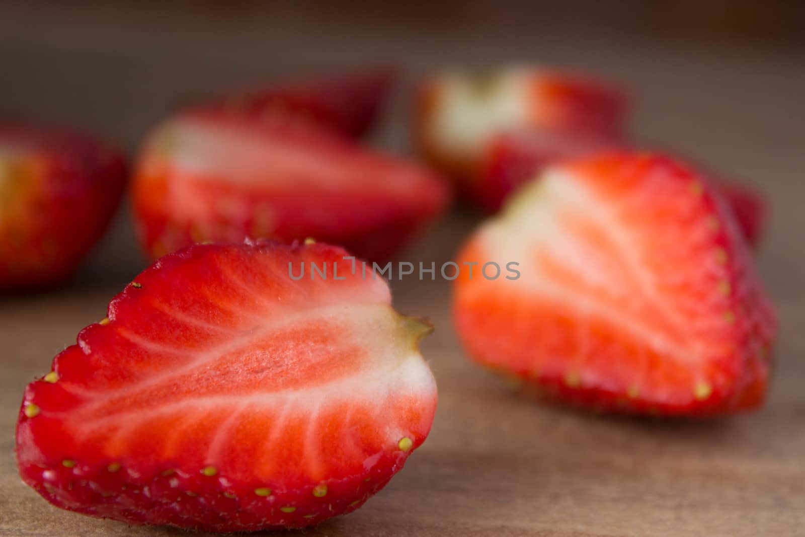 red ripe  fresh strawberries on wooden table