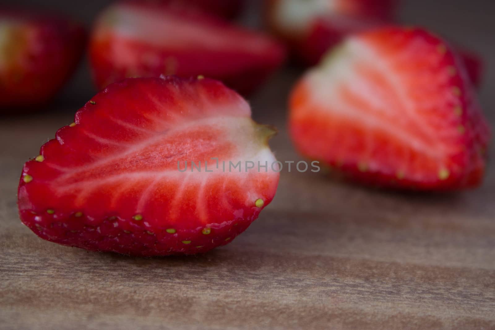 red ripe  fresh strawberries on wooden table