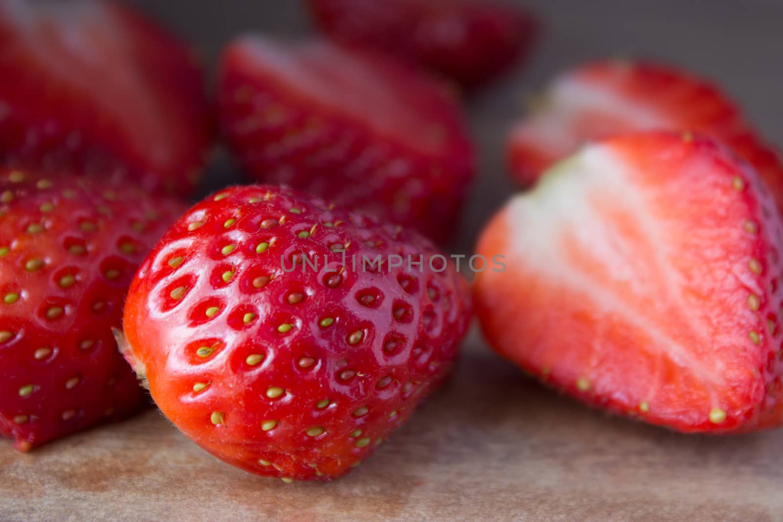 red ripe  fresh strawberries on wooden table