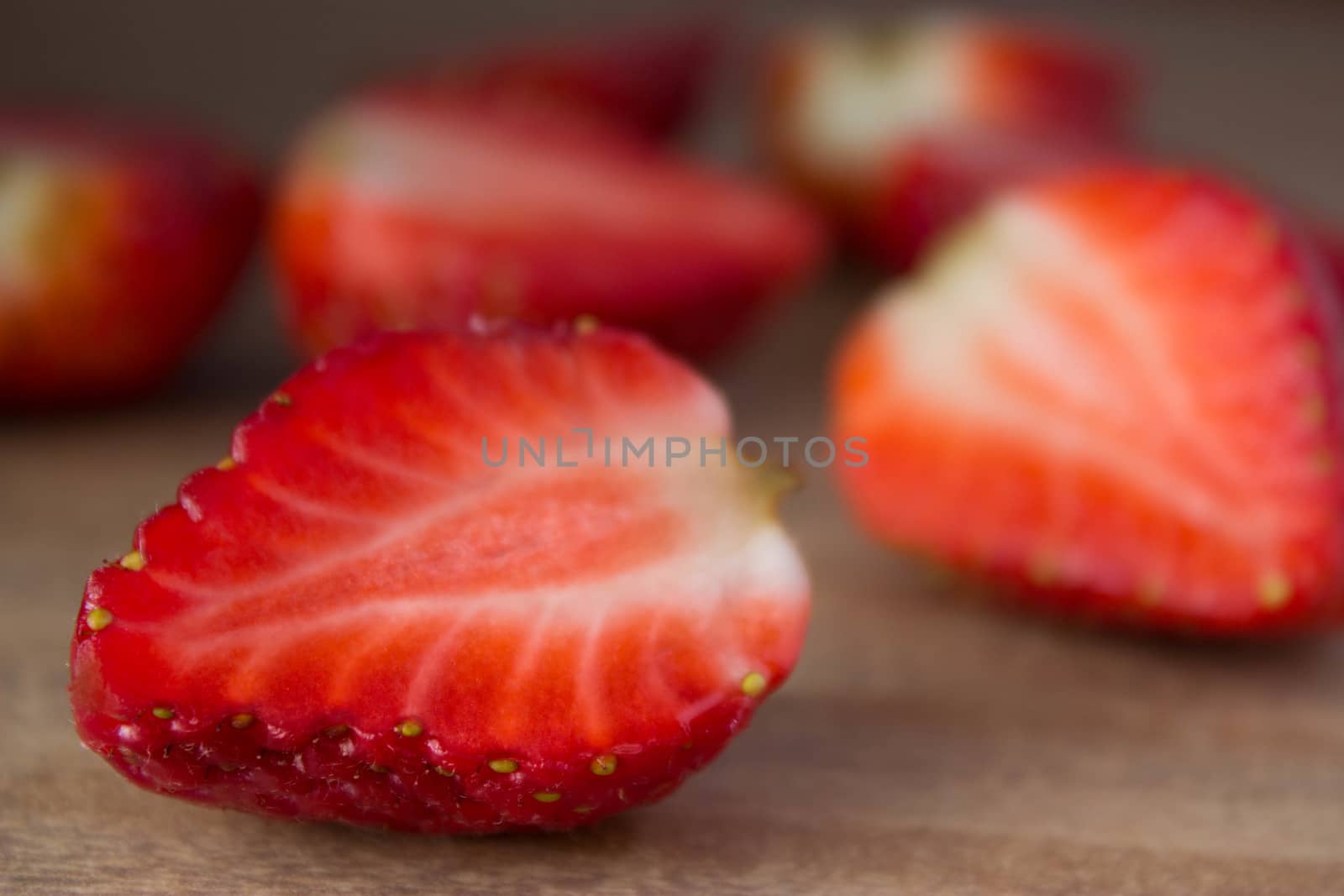 red ripe  fresh strawberries on wooden table