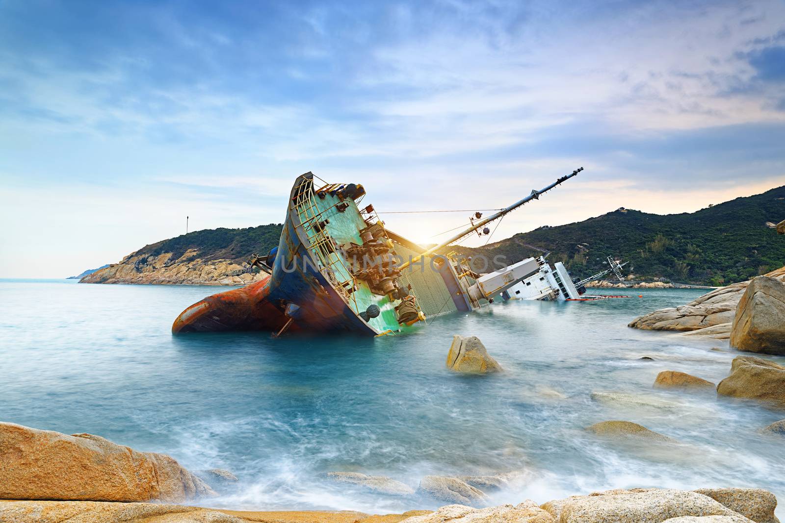 shipwreck or wrecked cargo ship abandoned on sea bay